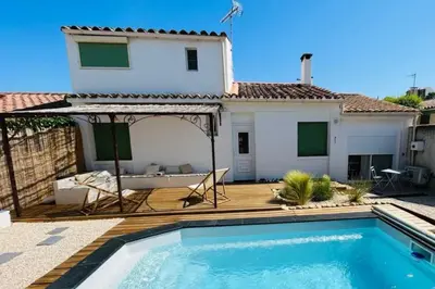 a villa with a swimming pool and a house at Alma Viva - Piscine Privée - Climatisée - Parking in Velaux