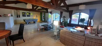 a living room with a couch and a piano at Domaine des Francobelges - Appartements in Lauris