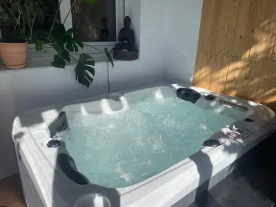a bath tub filled with water in a room at Charming Studio to Venelles 10 minutes from Aix in Venelles