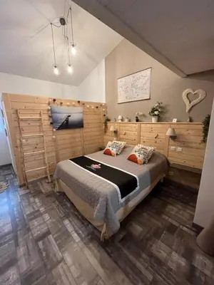 a bedroom with a large bed in a room at 84A - 