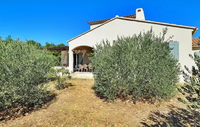a house with two olive trees in front of it at Li Vue Vent in Saint-Rémy-de-Provence