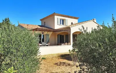 a white house with trees in front of it at Li Vue Vent in Saint-Rémy-de-Provence