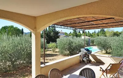 a view of a patio with a camera on a porch at Li Vue Vent in Saint-Rémy-de-Provence