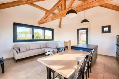 a living room with a table and a couch at Village Pont Royal en Provence - maeva Home - Appartement climatisé 3 pièces 4 personnes avec terrasse aménagée - Prestige - super Home MAE-3084 in Mallemort