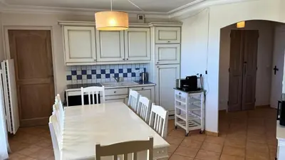 a kitchen with a table and chairs and a kitchen with a sink at Village Pont Royal en Provence - maeva Home - Appartement climatisé 4 pièces 6 personnes - Prestige MAE-3234 in Mallemort