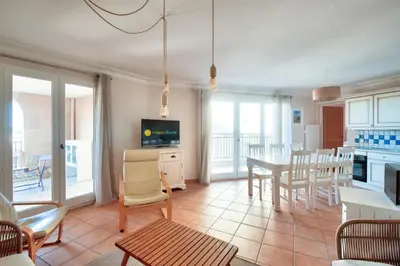 a living room with a kitchen and a dining room at Village Pont Royal en Provence - maeva Home - Appartement climatisé 4 pièces 6 personnes - Prestige MAE-3234 in Mallemort