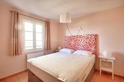 a bedroom with a bed and a window at Village Pont Royal en Provence - maeva Home - Appartement climatisé 4 pièces 6 personnes - Prestige MAE-3234 in Mallemort