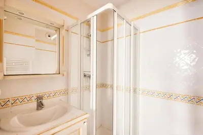 a bathroom with a sink and a shower at Village Pont Royal en Provence - maeva Home - Appartement climatisé 4 pièces 6 personnes - Prestige MAE-3234 in Mallemort