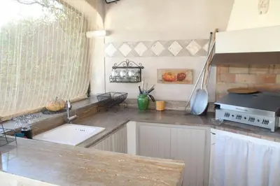 a kitchen with a sink and a counter top at Lou Mas dou Souleou & Spa in Cheval-Blanc