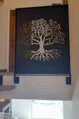 a framed picture of a tree on a wall at Maison de la bonne fontaine. in Lauris
