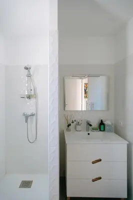 a white bathroom with a shower and a sink at La Dolce Vita Provençale Charming House with its Private Swimming Pool in LʼIsle-sur-la-Sorgue