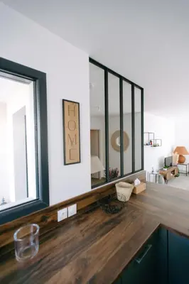 a living room with a large mirror on the wall at La Dolce Vita Provençale Charming House with its Private Swimming Pool in LʼIsle-sur-la-Sorgue