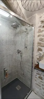 a shower stall in a bathroom with a sink at Latipik in Lançon-Provence