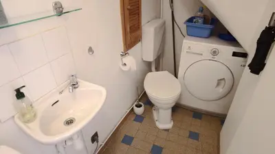 a small bathroom with a toilet and a sink at Lovely house teracce and parking in historic center in Aix-en-Provence