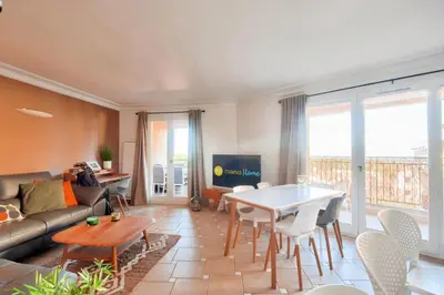 a living room with a couch and a table at Village Pont Royal en Provence - maeva Home - Appartement climatisé avec terrasse 4 pièces 7 personnes - Prestige - super Home MAE-3801 in Mallemort