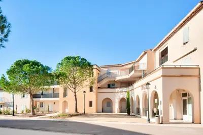 an empty street in front of a building at Village Pont Royal en Provence - maeva Home - Appartement climatisé avec terrasse 4 pièces 7 personnes - Prestige - super Home MAE-3801 in Mallemort