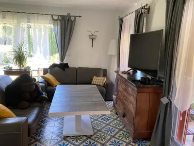 a living room with a couch and a table at Domaine des Lavarines in Morières-lès-Avignon
