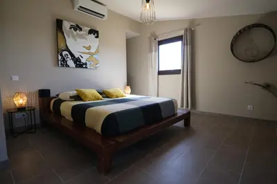 a bedroom with a large bed in a room at Provençal farmhouse, Mont Ventoux view, 2 pools (1 heated), Bédoin - 10 people in Bédoin