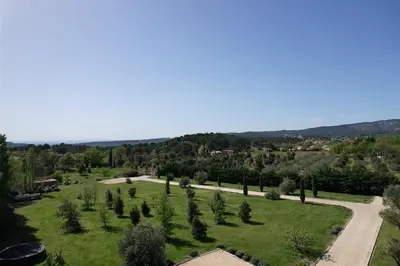 an aerial view of a park with trees and a road at Provençal farmhouse, Mont Ventoux view, 2 pools (1 heated), Bédoin - 10 people in Bédoin