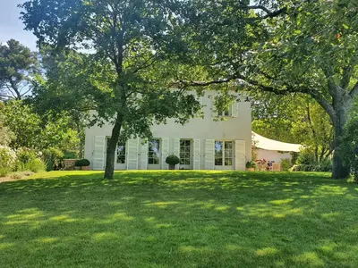 a house with a large lawn in front of it at Lou Pantai, Bed and breakfast, small double Bedroom in Aix-en-Provence