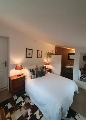 a bedroom with a large white bed and two lamps at Lou Pantai, Bed and breakfast, small double Bedroom in Aix-en-Provence