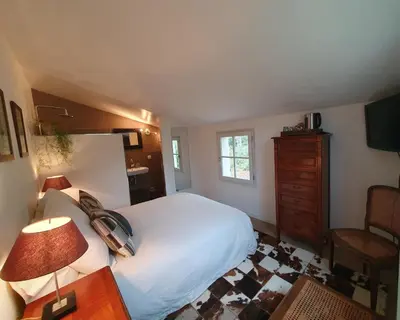 a bedroom with a white bed and a dresser at Lou Pantai, Bed and breakfast, small double Bedroom in Aix-en-Provence