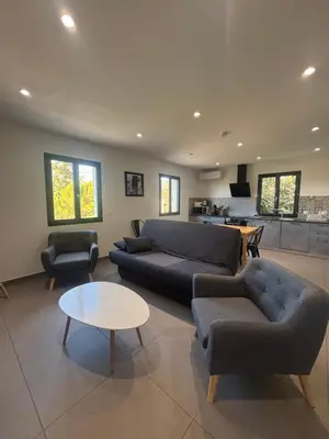 a living room with a couch and two chairs and a table at Appartement neuf Bédoin - Les Cinglés du Mont Ventoux in Mormoiron