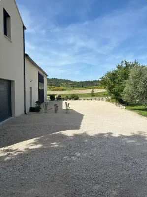 a black pot sitting on the side of a road at Appartement neuf Bédoin - Les Cinglés du Mont Ventoux in Mormoiron