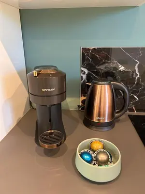 a coffee maker and a bowl of eggs on a counter at Appartement cosy in Aix-en-Provence
