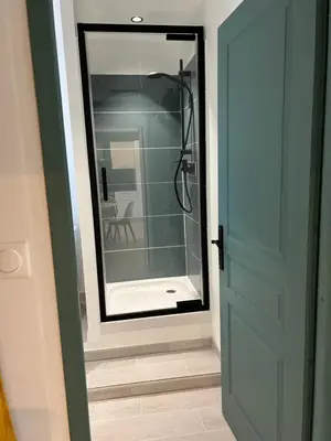 a bathroom with a mirror and a shower at Appartement cosy in Aix-en-Provence
