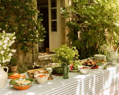 a table with vegetables and other foods on it at Le Clos de Gordes in Gordes