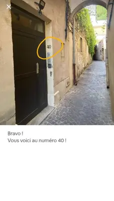 a door with the number next to a street at Escapades L'Isloises au cœur de L'Isle-sur-la-Sorgue. in LʼIsle-sur-la-Sorgue