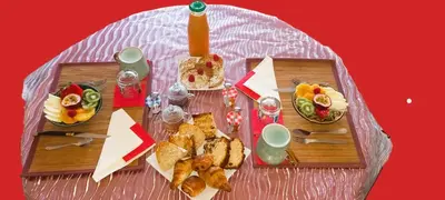 a table with a bunch of food on it at Les Myosotis Cavaillon/Petit Luberon in Cavaillon
