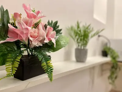 a vase of flowers on a counter with plants at *Le Lotus*Fiber Wifi*Hyper Center* in Salon-de-Provence