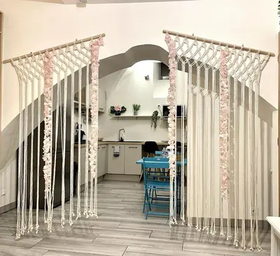 a room with a table with pink and white curtains at *Le Lotus*Fiber Wifi*Hyper Center* in Salon-de-Provence