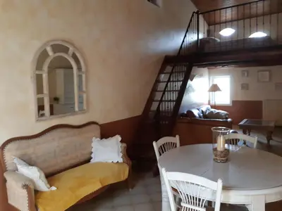 a living room with a couch and a table at Cherche Midi in Noves