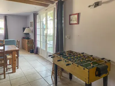 a game room with a foos ball on a table at Le Petit Mas Rey in Eyragues