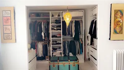 a walk in closet filled with lots of clothes at House of Essia in Aix-en-Provence