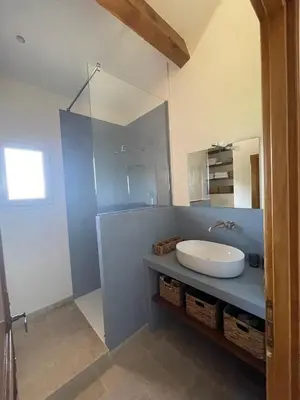 a bathroom with a sink and a mirror at Maison d’Oléa in Bonnieux
