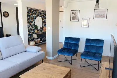 a living room with a couch and two blue chairs at Appartement design pour 6 pers dans le centre de Salon de Pce - Proche Fontaine Moussue in Salon-de-Provence