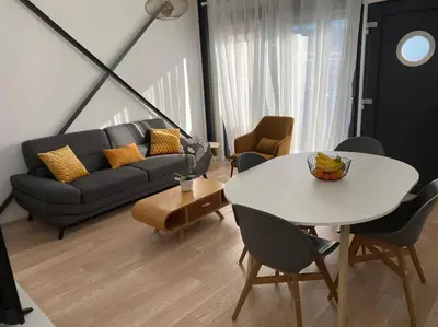 a living room with a white table and a couch at 