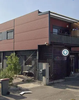 a building with a gate in front of it at 
