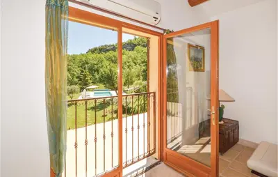 a room with a balcony with a sliding glass door at Cozy Home In Apt With Wifi in Apt