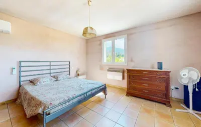 a bedroom with a bed and a dresser and a window at 3 Bedroom Stunning Home In Bédoin in Bédoin