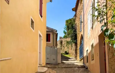an alley between two buildings with at 3 Bedroom Stunning Home In Bédoin in Bédoin