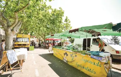 a food truck with avertisement at Amazing Home In St Martin De Castillon in Saint-Martin-de-Castillon