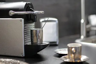 a kitchen counter with a toaster and two cups at STUDIO Mr&Mrs in Aix-en-Provence