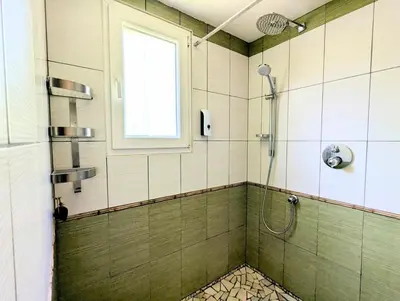 a bathroom with a shower with a window at L'Escargolette - Incroyable maison de vacances 4 étoiles in Carpentras