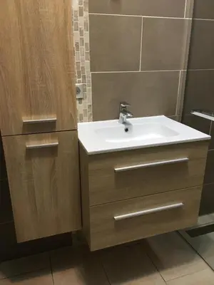 a bathroom with a sink and a mirror at VILLA AVEC PISCINE in Roussillon