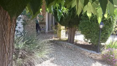 a building with a street light next to a tree at Provence Vaucluse Ventoux Villa Caromb in Caromb